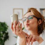 woman with money she saved with new tax rules 2025